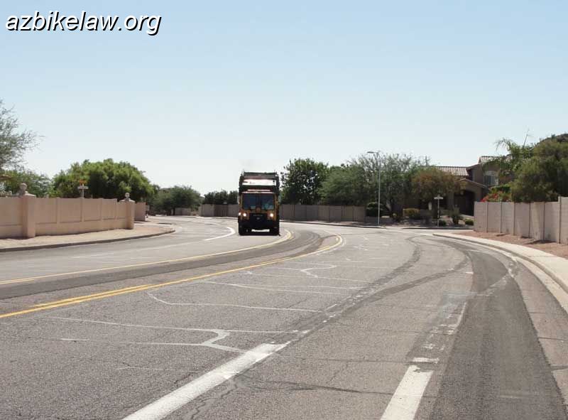 36thStreetSB.jpg - 36th street southbound; Note that the lane is clearly not sharable side-by-side (use the garbage truck for reference).The stripes from what was the temporary circle at Coconino were slurried/ground off but can still be seen.