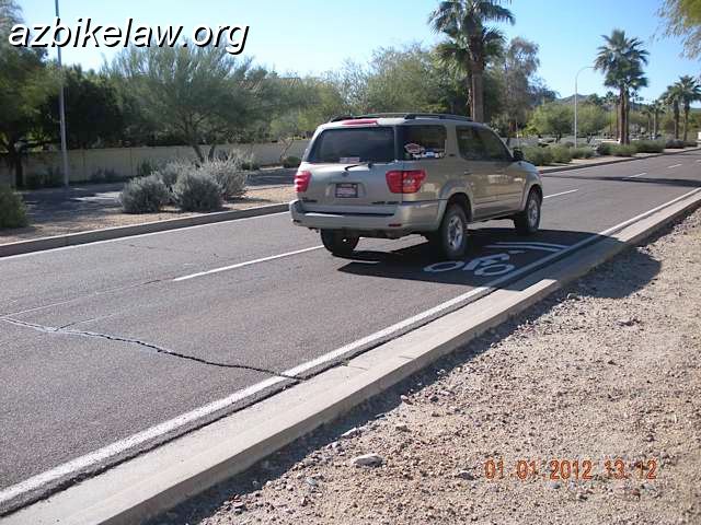 DSCN4455-.JPG - Photo credit: Mike SandersNew (test?) sharrow 48th st (technically, it's actually guadalupe rd, see map) SB just S of Guadalupe Bridge .  This pretty much defeats the intention of the sharrow (which is to properly position cyclists in the middle of a narrow lane).photo taken 1/1/2012                        