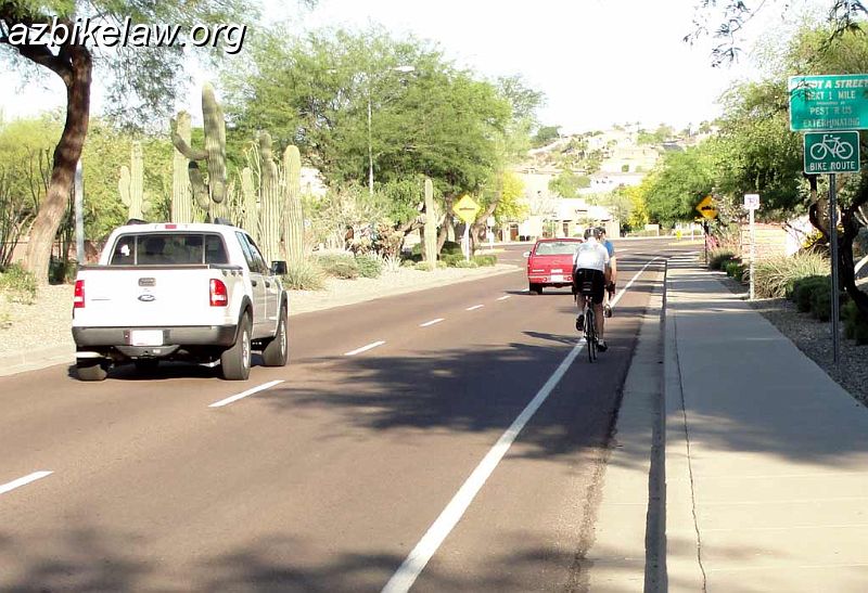 DSC01120.jpg - Chandler Blvd; section between 24th St and Desert Foothills Parkway. Phoenix, AZ. Narrow shoulder is often mis-taken for a bike lane: cyclists ride further to the right than they should, and motorists neglect to change lanes, preferring to "skim by".