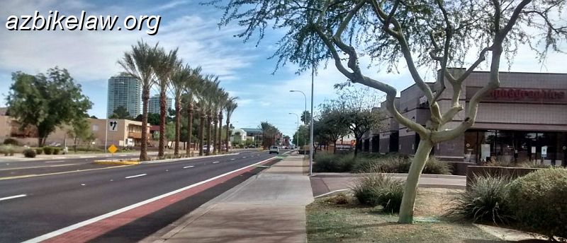 IMG_20150214_110358905_HDR~2_01.JPG - University project. The new medians (where the large palm trees are) caused much grumbling among merchants. This median was originally going to be longer; and would have prevented westbound traffic from turning left into Alphagraphic's driveway. This was felt (by alphagraphics) to be an undue hardship. That traffic would have to make a left at McKemy instead, perhaps 150' away, and enter Alphagraphic's parking lot from the other driveway.