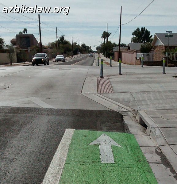 IMG_20150214_111827842~2_01.JPG - Hardy Streetscape Project Completed early 2015: SB at Howe St. At this point the (for lack of a better term) traditional BL transitions to a sidewalk/sidepath/bikepath. The bollards look to be especially dangerous to unwitting bicyclists; as well as a liability issue for the City of Tempe.The bollards are heavy gauge steel pipe.This is a speed table.