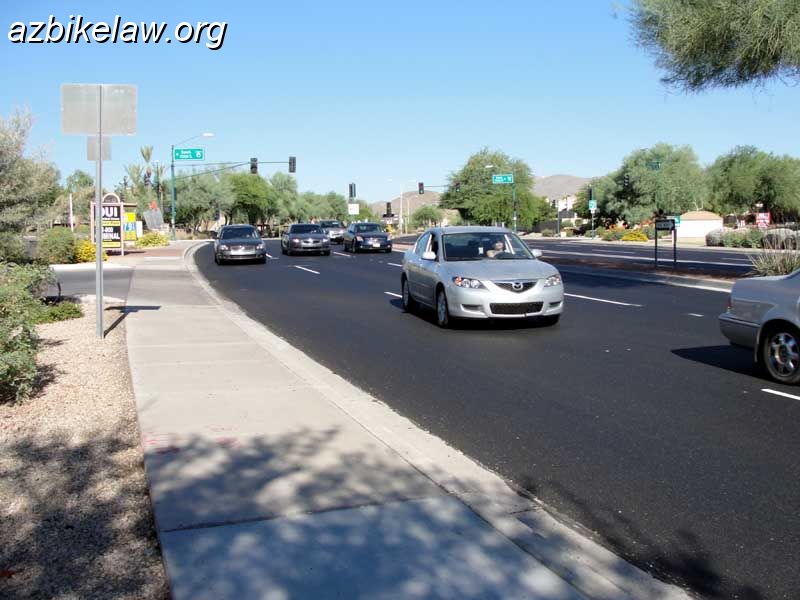 RayNostripe2.jpg - Eastbound Ray Road, just past Ranch Circle South, Phoenix, AZ. This stretch (to 44th St) formerly had an onerous edge stripe. The stripe was removed, in this small stretch, when part of Ray Road was resurfaced in June 2010.