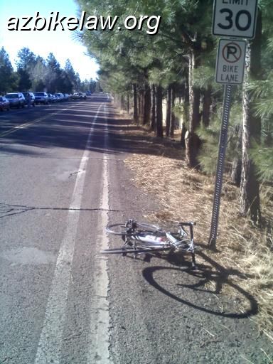 r7-9aMisuse.jpg - R7-9a sign.  Flagstaff, AZ;  Turquoise, south of Cedar. Incorrect signage perpetuates  bike lane myths.  MUTCD 9B.10  "If the installation of signs is necessary to restrict parking, standing, or stopping  in a bicycle lane ...". Is this a bicycle lane?