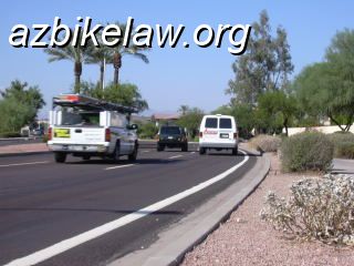 ray1.jpg - Ray Road, Phoenix AZ. Edgeline and VERY small shoulder to the right of a narrow travel lane. This road is a signed Bike Route, incidentally    http://azbikelaw.org/blog/is-this-a-bike-lane/